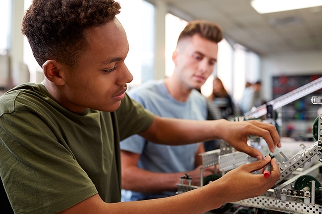 High school students working on electronics