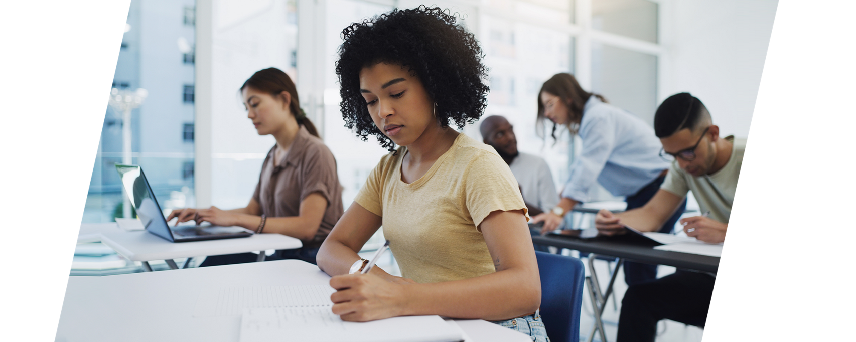 Diverse group of students working in a classroom