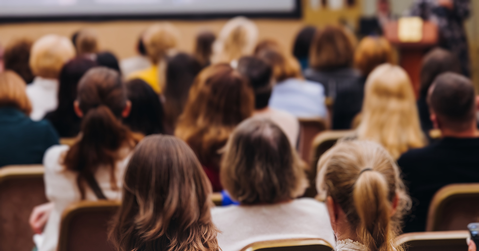 Audience listening to a conference lecture