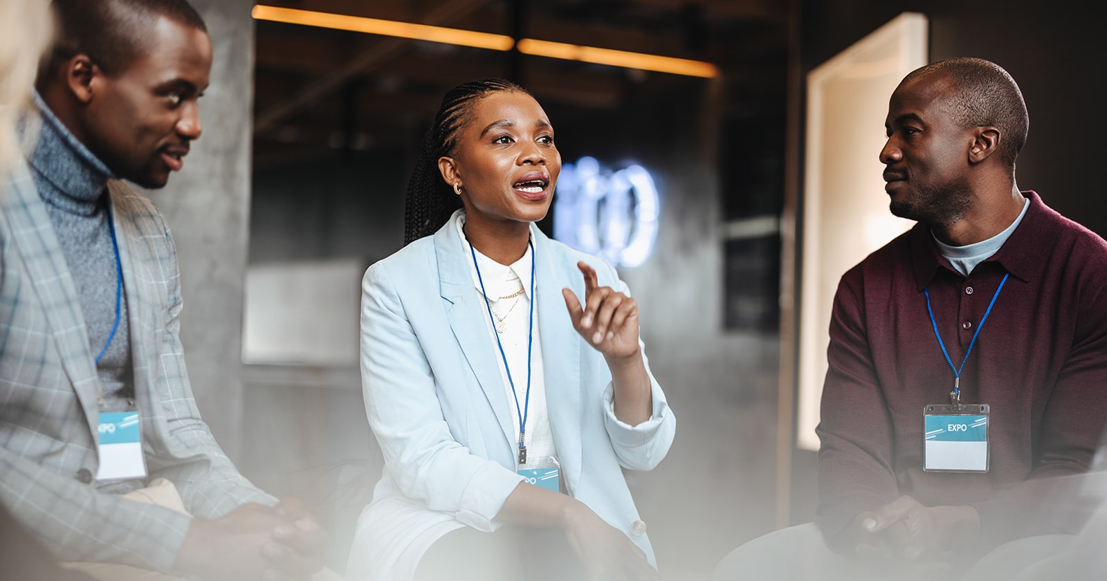 Group of Black businesspeople speaking at a conference