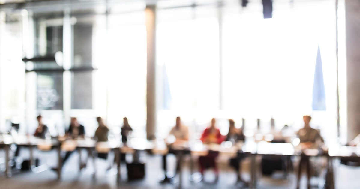 fogged image of people sitting at the table