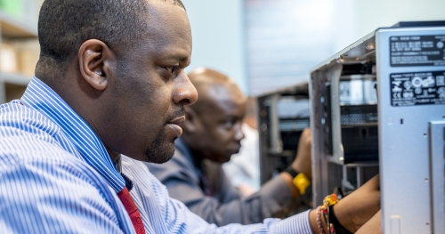 Man working on computer hardware