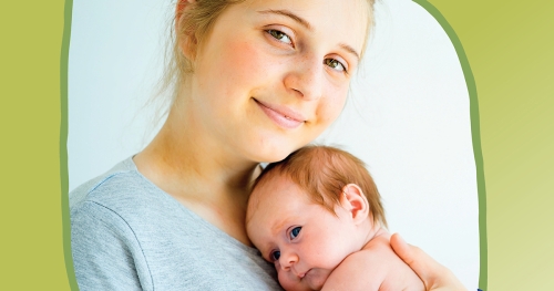 Mother holding newborn to her chest