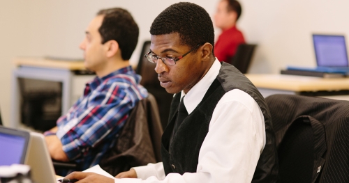Black man working on a computer
