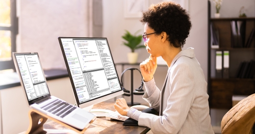 Woman working on computer in home office