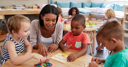 a teacher in a circle with kids