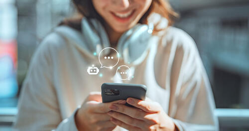 a teenager is texting on a phone