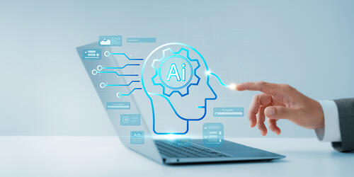 a hand with on laptop with AI concept