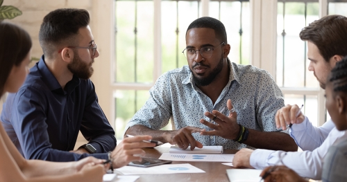 Black man shares insights with diverse group of listeners