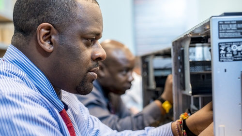 Man working on computer hardware