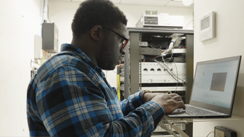 a man fixing a computer