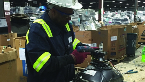 a man working on a factory setting