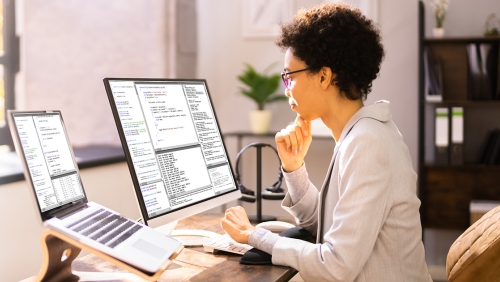 Woman working on computer in home office