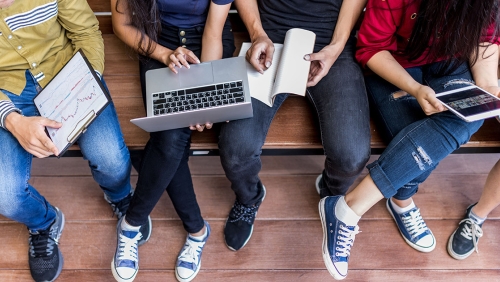 a group of students with laptops