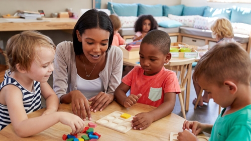 a teacher in a circle with kids