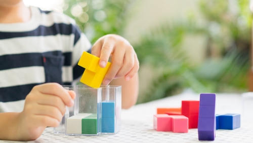 a kid playing with a constructor