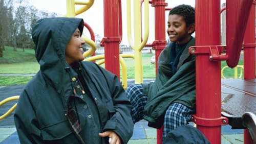 Black mom and son at a playground