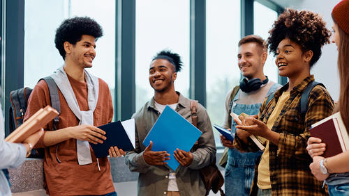 Diverse group of college students chatting