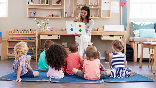 Teacher talking about shapes with pre-k students