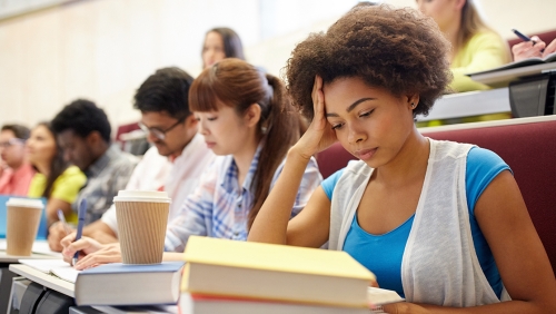 Diverse group of college students in lecture hall