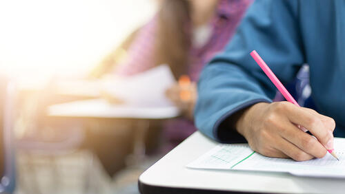 students writing a test in college
