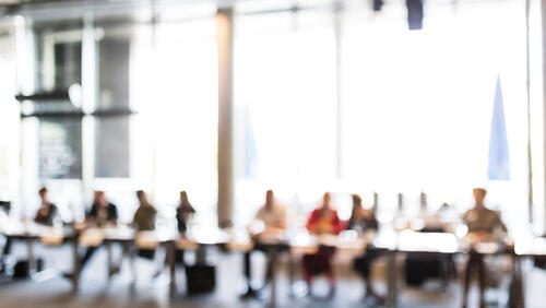 fogged image of people sitting at the table