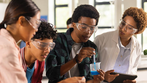 High schoolers working on a science experiment