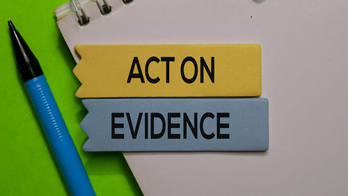 Words Action and Evidance on the notepad