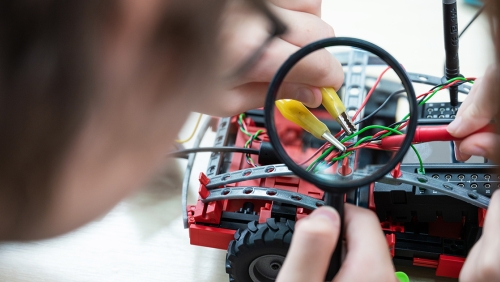 High school students working on a circuitry project