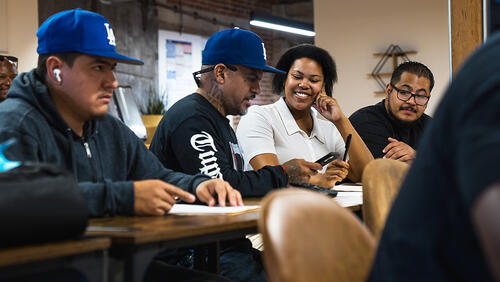 a group of people around the table