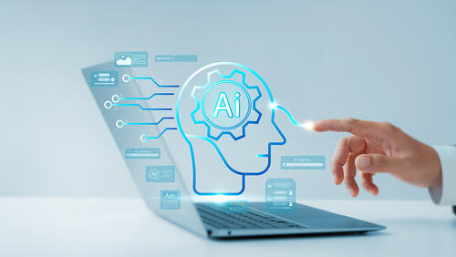 a hand with on laptop with AI concept