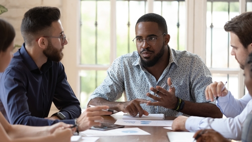 Black man shares insights with diverse group of listeners