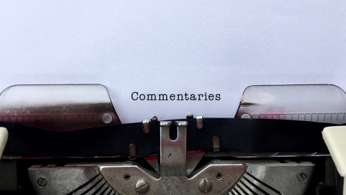 The word "Commentaries" on a piece of a paper in a typewriter