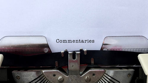 Paper in typewriter that reads 'Commentaries'