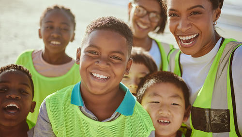 group of teenagers volunteer eco friendly beach
