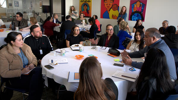 Group of colleagues sitting around a round table