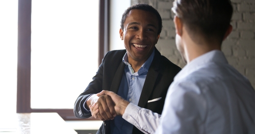 Job candidate shaking hands with interviewer