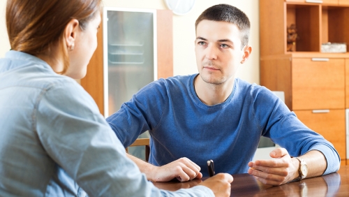 Man speaking with counselor