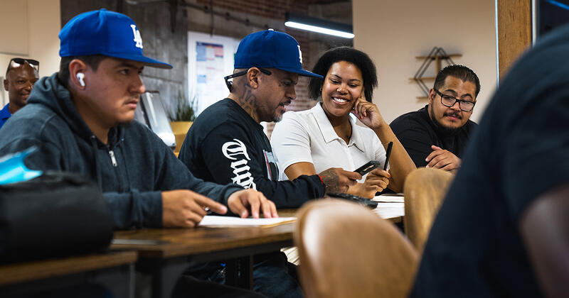 a group of people around the table